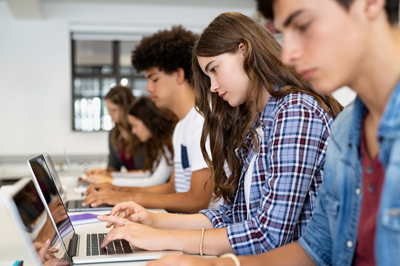 Students working on their laptop computers.